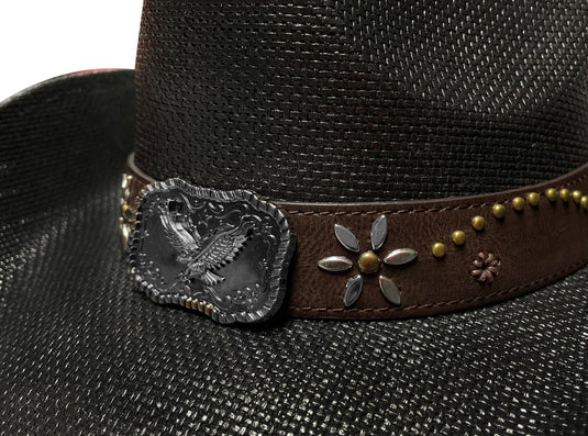 CLose-up view of an ornament of a black straw cowboy hat.