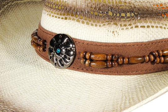 Close-up view of circular bead ornament of a beige straw cowboy hat.