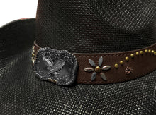 Load image into Gallery viewer, CLose-up view of an ornament of a black straw cowboy hat.
