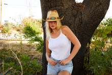 Load image into Gallery viewer, Woman wearing beige straw cowboy hat with blue bead facing front.
