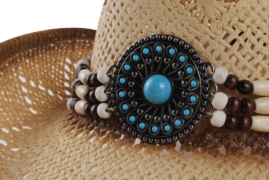 Close-up view of circular bead on a beige cowboy hat.