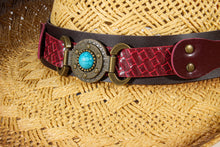 Load image into Gallery viewer, Close-up of the red band with circular bead ornament of a straw cowboy hat.
